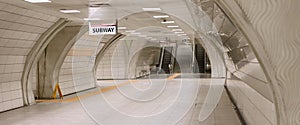 Underground subway station hallway tunnel with escalator. Abstract perspective view