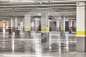 Underground vehicle parking lot. Brand new empty garage. Transport