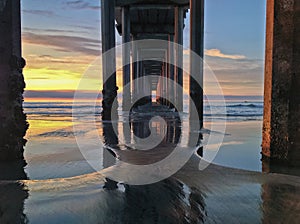 Underneath Beach Pier at Sunset with Colorful Sky, La Jolla, CA