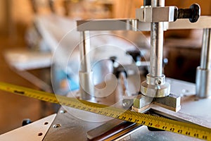 Underpinner on focus, picture framer tool in a small workshop