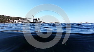 Undersea view with boat and blue sea