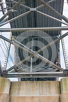 Underside of the Bourne Bridge showing the intricate ironworks and heavy cement footings