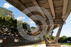 Underside of Bridge with Mountain and Trees