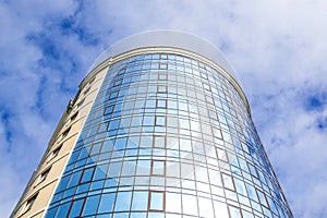 Underside panoramic and perspective view to steel blue glass high rise building skyscrapers, industrial architecture