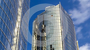 underside panoramic and perspective view to steel glass high rise building skyscrapers timelapse, Dubai, UAE