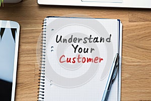 Understand Your Customer Text Written On Spiral Notepad