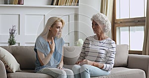 Understanding old mother helping stressed young daughter share problem