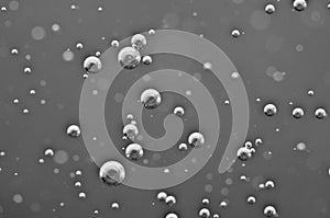 Underwater air bubbles in black-and-white. Macro
