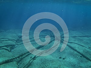 Underwater cables, ocean floor background