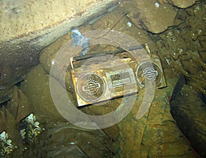 Underwater deep diving, old radio found inside drowned ship, wrack dive research