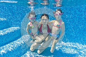Underwater family in swimming pool
