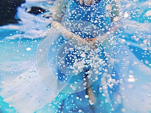 Underwater fashion portrait of beautiful blonde young womanAbstract Underwater fashion portrait of beautiful young woman
