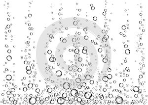 Underwater fizzing air bubbles or soda pop on white background photo