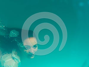 Underwater girl in swimming pool