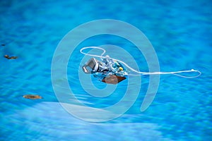 Underwater photo camera housing floating on water