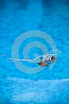 Underwater photo camera housing floating on water
