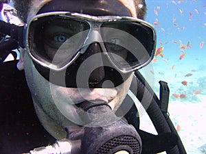 Underwater photo, face of scuba diver