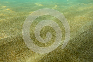 Underwater photo, shallow sea with sand