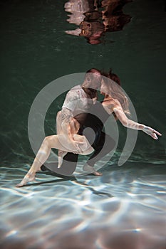 Underwater Photoshoot of a Couple in Love. Man and Woman