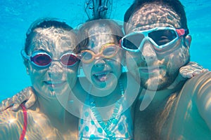 Underwater portrait of family