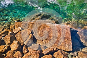 Underwater rocks in Temnosmrecianske pleso tarn in High Tatras during spring