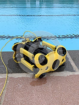 Underwater ROV camera drone next to swimming pool