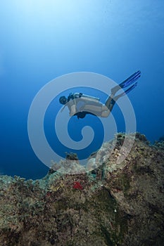 Underwater scene : scuba diver in deep water