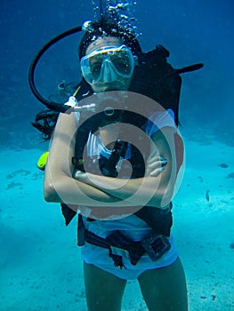 Underwater shoot of a woman diving with scuba