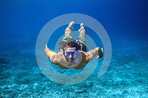 Underwater shoot of a young man snorkeling in a tropical sea.