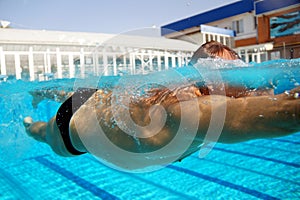 Underwater shooting of a swimmer in a swimming pool