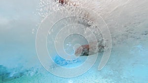 Underwater shot of male hand under water in fast powerful stream. Concept of fighting and going against the current.