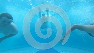 Underwater Shot Of People Jumping To A Big Pool