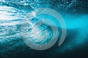 Underwater surfing wave in tropical ocean