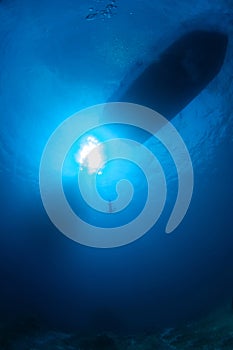 Underwater view on boat at surface