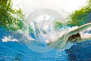 Underwater View Of A Man Jumping Into The Water