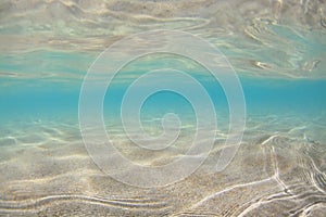 Underwater view of sand beach in sea tropical lagoon