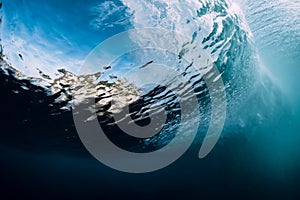 Underwater wave and bubbles. Transparent water and breaking ocean wave