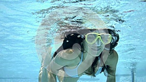 Underwater woman in bikini and goggles