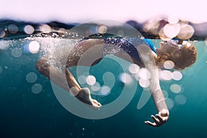 Underwater woman with bubbles in ocean