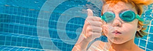 Underwater Young Boy Fun in the Swimming Pool with Goggles. Summer Vacation Fun BANNER, LONG FORMAT