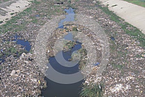 An undesignated urban dump on the Los Angeles River in Compton, California