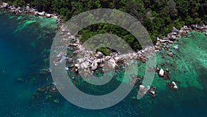 Undiscovered beach palm trees smooth rocks. Spectacular aerial view flight drone