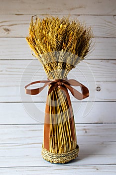Undle of wheat tied with a ribbon