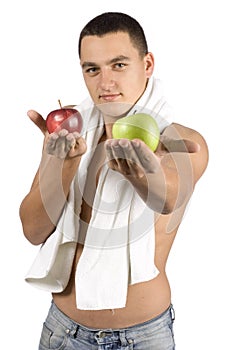 Undressed man with towel and two apples