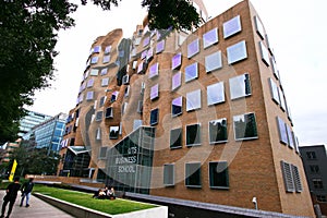 Wavy brick facade of Dr Chau Chak Wing Building with array of rectangular windows at University Technology Sydney UTS, Australia