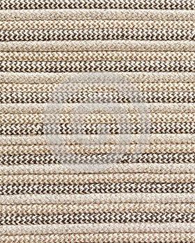 Undyed wool rug texture in neutral tones