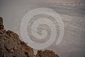 Unearthly landscape in rocky high mountains in fog