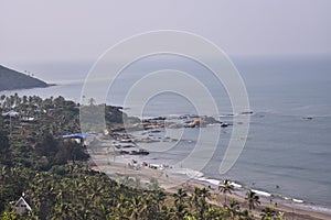 Unedited image of a beach from the top of a hill