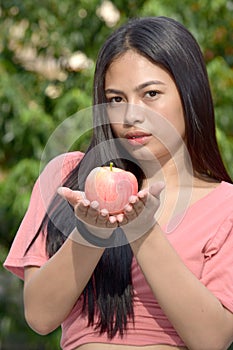 An Unemotional Adult Female With Apples