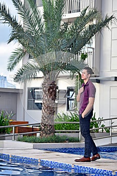 Unemotional Male Man Standing By Pool